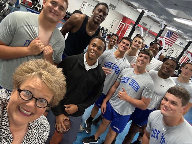 President Dr. Rosemary M. Thomas visits with student at Fork Union Military Academy.